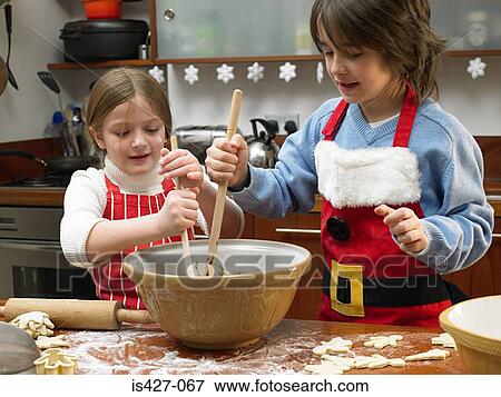Kids making cookies View Large Photo Image Stock Photo - Kids making cookies. Fotosearch