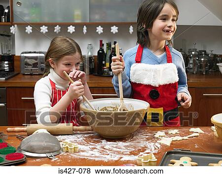 Kids making cookies View Large Photo Image Stock Photo - Kids making cookies. Fotosearch