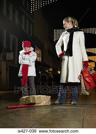 Mother and daughter christmas shopping View Large Photo Image Stock Photo - Mother and daughter christmas shopping. Fotosearch
