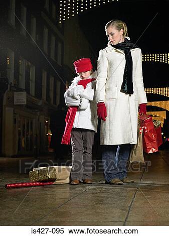 Stock Photography - Mother and daughter christmas shopping. Fotosearch