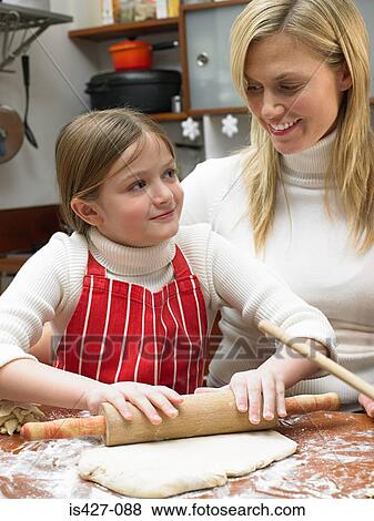 Mother and daughter making cookies View Large Photo Image Stock Photo - Mother and daughter making cookies. Fotosearch