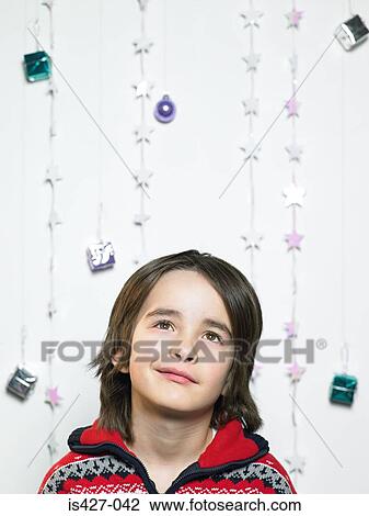 Portrait of a child with christmas decorations View Large Photo Image Stock Image - Portrait of a child with christmas decorations. Fotosearch
