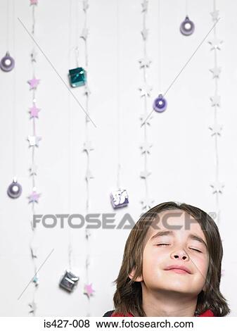 Portrait of a child with christmas decorations View Large Photo Image Stock Photo - Portrait of a child with christmas decorations. Fotosearch