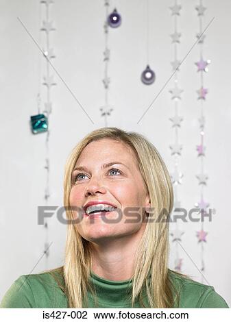 Portrait of woman with christmas decorations View Large Photo Image Stock Image - Portrait of woman with christmas decorations . Fotosearch
