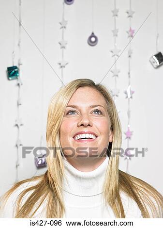 Portrait of woman with christmas decorations View Large Photo Image Stock Photograph - Portrait of woman with christmas decorations. Fotosearch
