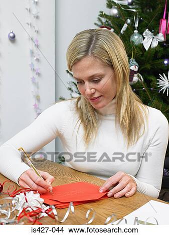 Woman writing christmas cards View Large Photo Image Picture - Woman writing christmas cards. Fotosearch