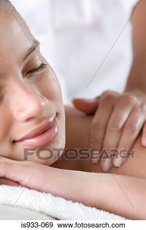 Girl having a massage View Large Photo Image Stock Photo - Girl having a massage. Fotosearch