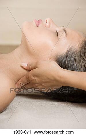 Girl having her neck massaged View Large Photo Image Stock Image - Girl having her neck massaged. Fotosearch