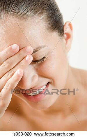 Girl touching forehead View Large Photo Image Stock Image - Girl touching forehead. Fotosearch