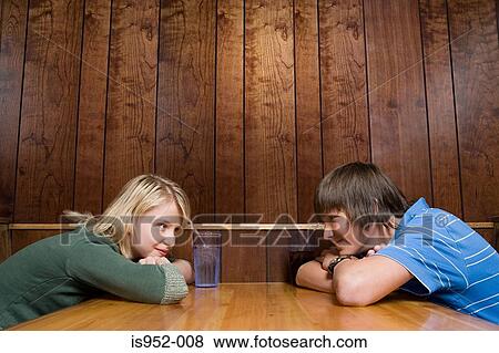 Teenage boy and girl facing each other View Large Photo Image Stock Photo - Teenage boy and girl facing each other . Fotosearch