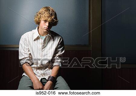 Teenage boy sat alone View Large Photo Image Stock Photograph - Teenage boy sat alone. Fotosearch
