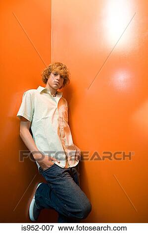 Stock Photo - Teenage boy standing alone. Fotosearch