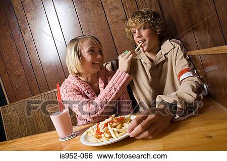 Stock Photograph - Teenage couple on a date. Fotosearch