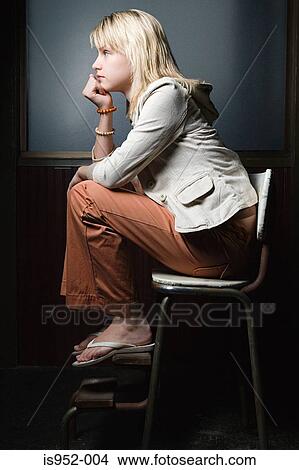 Teenage girl sat alone View Large Photo Image Picture - Teenage girl sat alone. Fotosearch