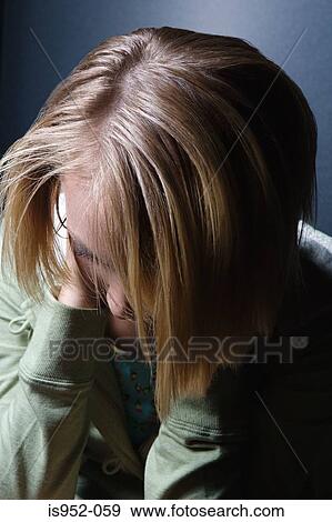 Teenage girl with head in her hands View Large Photo Image Stock Photo - Teenage girl with head in her hands. Fotosearch