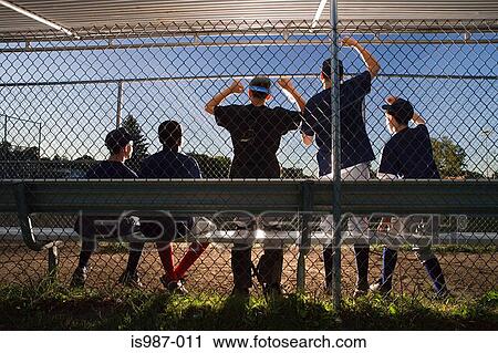Stock Image - Five teenagers watching from the sidelines. Fotosearch