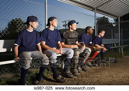 Stock Photography - Five teenagers watching from the sidelines. Fotosearch