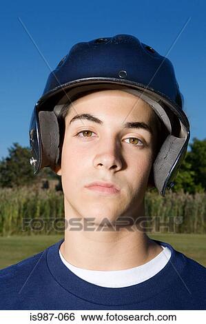 Stock Photograph - Portrait of a teenage boy wearing a helmet. Fotosearch