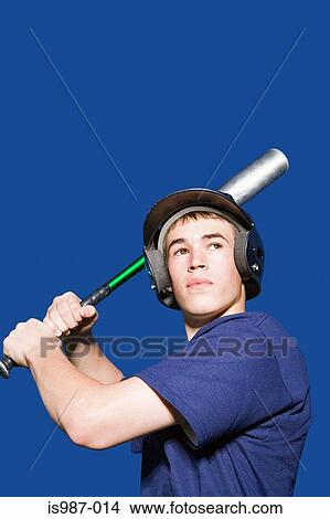 Teenage boy about to swing baseball bat View Large Photo Image Picture - Teenage boy about to swing baseball bat. Fotosearch