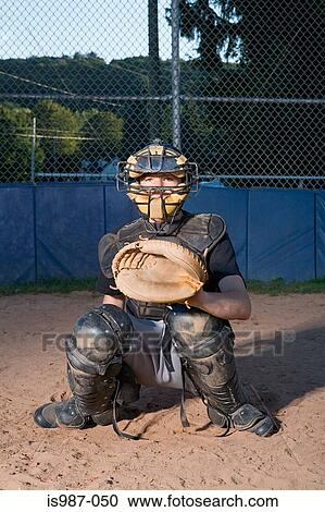 Stock Image - Teenage boy playing baseball. Fotosearch
