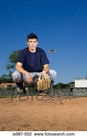 Teenage boy playing baseball View Large Photo Image Stock Image - Teenage boy playing baseball. Fotosearch