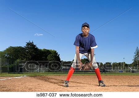 Teenage boy playing baseball View Large Photo Image Stock Photo - Teenage boy playing baseball. Fotosearch