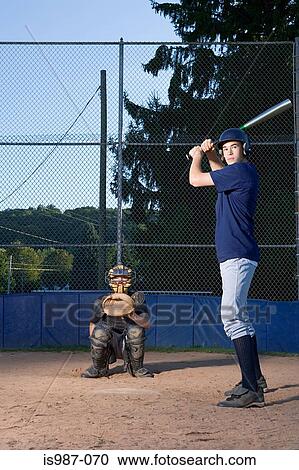 Teenage boy ready to hit baseball View Large Photo Image Stock Image - Teenage boy ready to hit baseball. Fotosearch