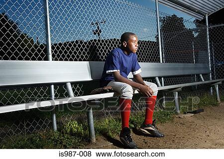 Stock Photo - Teenage boy watching from the sidelines. Fotosearch