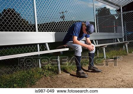 Stock Photo - Teenage boy watching from the sidelines. Fotosearch