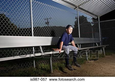 Teenage boy watching from the sidelines View Large Photo Image Stock Photo - Teenage boy watching from the sidelines. Fotosearch