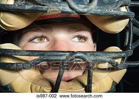 Stock Image - Teenage boy wearing a helmet. Fotosearch