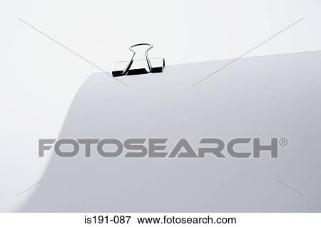 Stock Photo - Binder clip on paper. Fotosearch