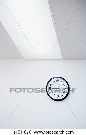 Clock on office wall View Large Photo Image Stock Photograph - Clock on office wall. Fotosearch