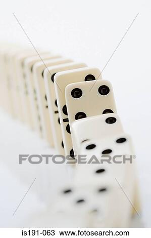 Stock Image - The domino effect. Fotosearch