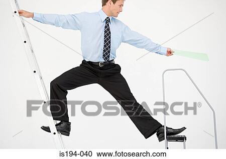 Businessman balancing on two ladders View Large Photo Image Stock Image - Businessman balancing on two ladders. Fotosearch
