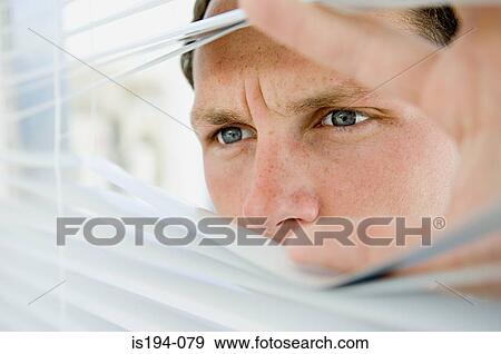 Businessman looking through blinds View Large Photo Image Stock Photo - Businessman looking through blinds. Fotosearch