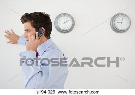 Businessman using cellular telephone View Large Photo Image Stock Photograph - Businessman using cellular telephone. Fotosearch