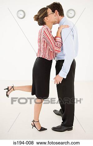 Businesswoman embracing businessman View Large Photo Image Stock Photo - Businesswoman embracing businessman. Fotosearch