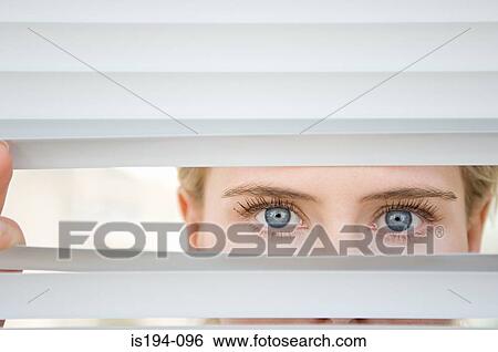Businesswoman looking through blinds View Large Photo Image Stock Photograph - Businesswoman looking through blinds. Fotosearch