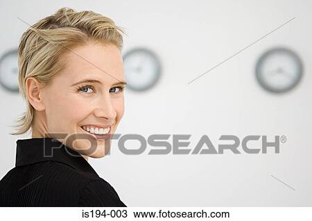 Businesswoman stood in front of three wall clocks View Large Photo Image Stock Image - Businesswoman stood in front of three wall clocks. Fotosearch