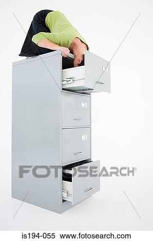 Businesswoman with head in filing cabinet drawer View Large Photo Image Stock Photography - Businesswoman with head in filing cabinet drawer. Fotosearch