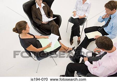 Five office workers in a meeting View Large Photo Image Stock Image - Five office workers in a meeting. Fotosearch