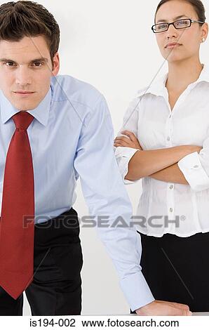 Stock Image - Portrait of a businessman and businesswoman. Fotosearch