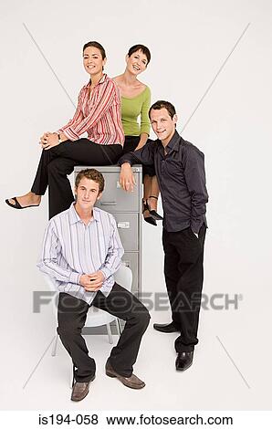 Stock Photo - Portrait of four office workers. Fotosearch