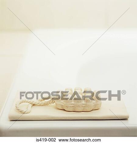 Stock Image - Massage soap on a bathtub. Fotosearch