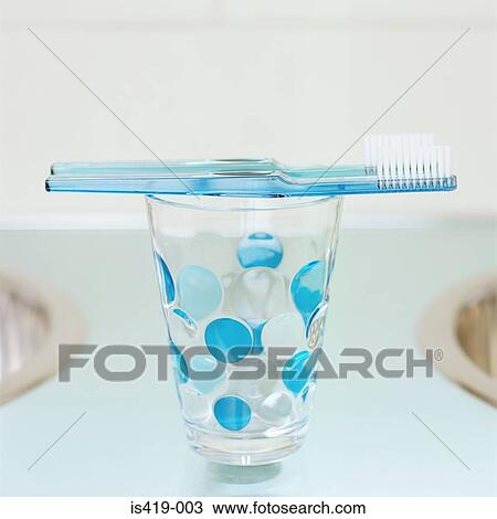 Toothbrushes on a beaker View Large Photo Image Stock Image - Toothbrushes on a beaker. Fotosearch