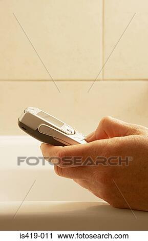 Woman texting in the bath View Large Photo Image Stock Image - Woman texting in the bath. Fotosearch