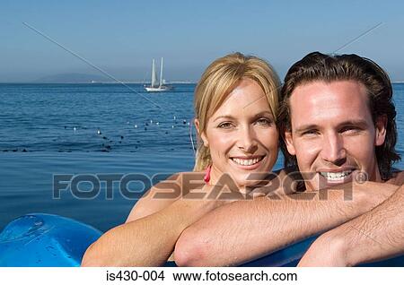 Picture - Couple in the sea. Fotosearch