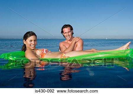 Couple in the sea View Large Photo Image Stock Image - Couple in the sea. Fotosearch