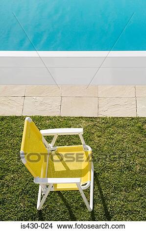 Picture - Deckchair by the pool. Fotosearch